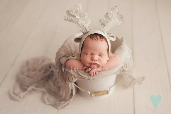 Newborn babies, and Christmas props, it doesn't get much cuter than that! Make sure you are prepared for your newborn's photo session with this list of props.